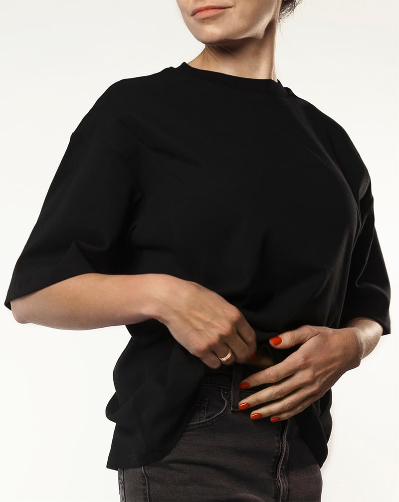 Woman wearing a loose black nursing t-shirt, ideal for breastfeeding fashion.