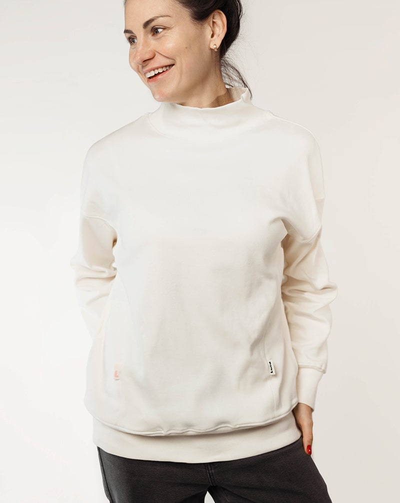 White nursing jumper with breastfeeding access and a comfortable fit.