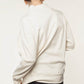 Back view of a white nursing jumper, highlighting its relaxed fit and smart design.