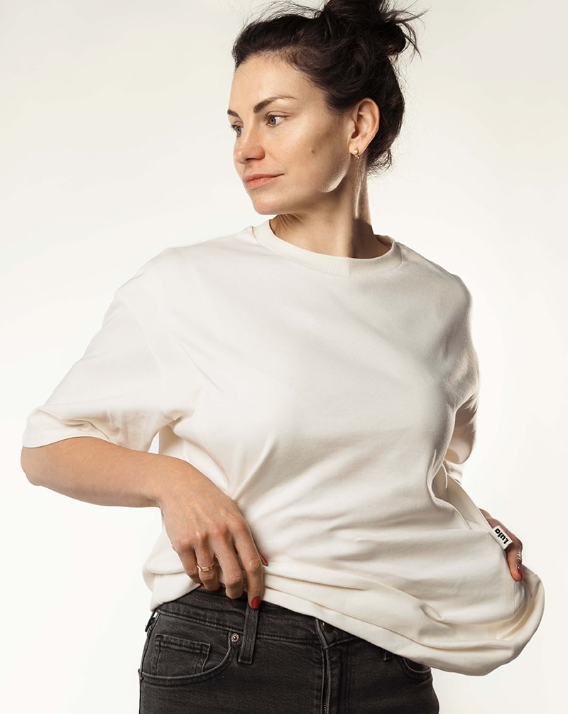 Woman wearing a loose white nursing t-shirt, ideal for breastfeeding fashion.